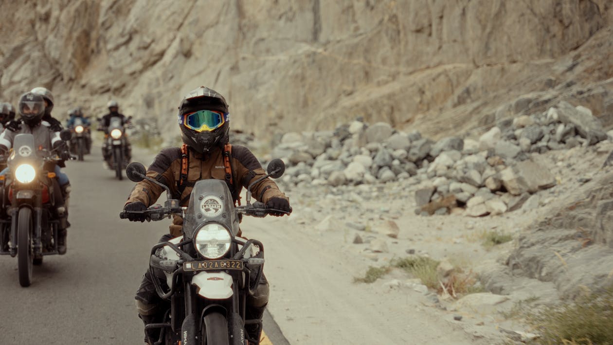 Group of adventure motorcyclists on mountain road